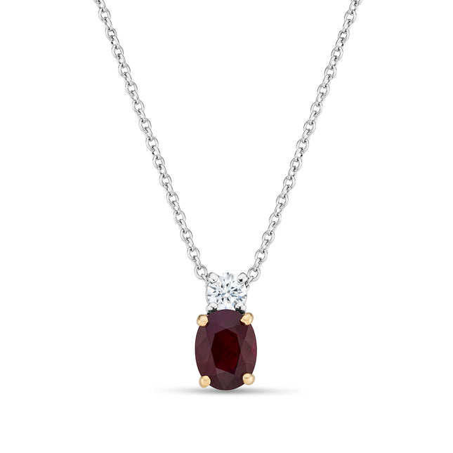 Oval Cut Ruby and Diamond Pendant in White and Yellow Gold