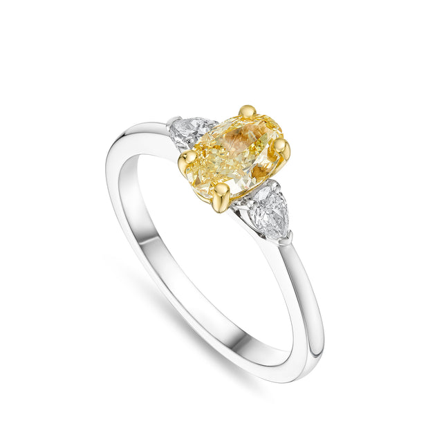 Oval Cut Yellow Diamond Trilogy Ring in Platinum and Yellow Gold