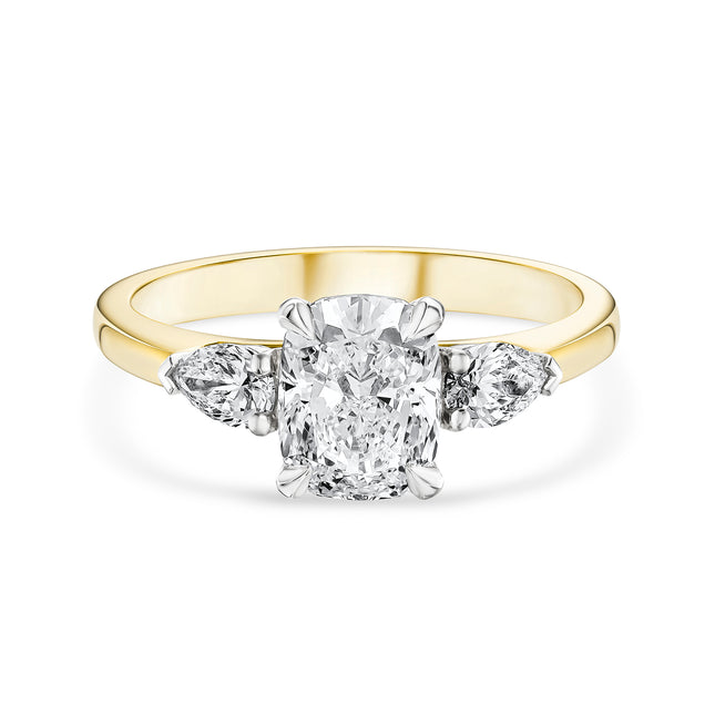 Cushion Cut Diamond Trilogy Ring in Yellow Gold and Platinum