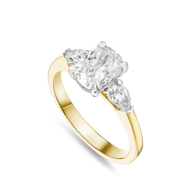 Cushion Cut Diamond Trilogy Ring in Yellow Gold and Platinum