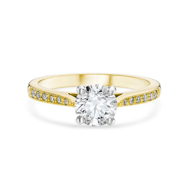 Round Brilliant Cut Diamond Ring with Side Stones in Yellow Gold and Platinum