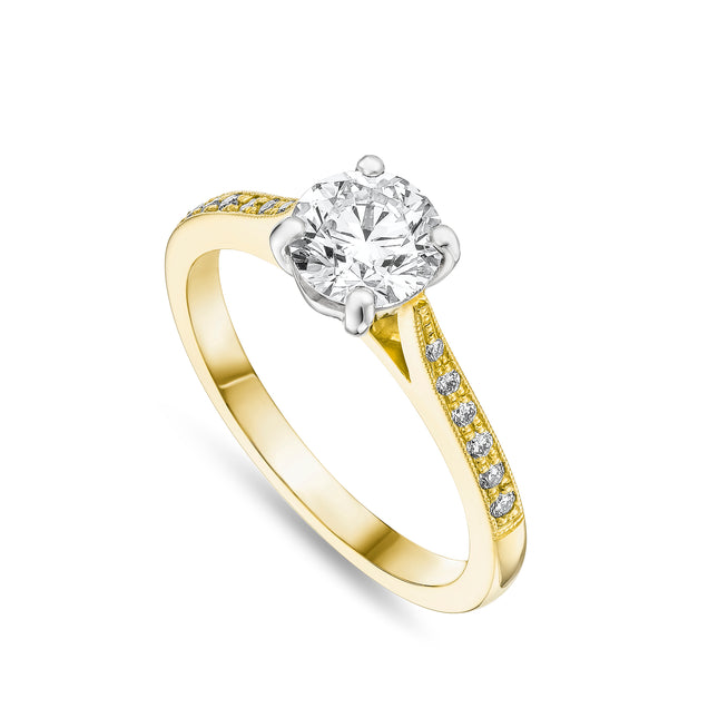 Round Brilliant Cut Diamond Ring with Side Stones in Yellow Gold and Platinum