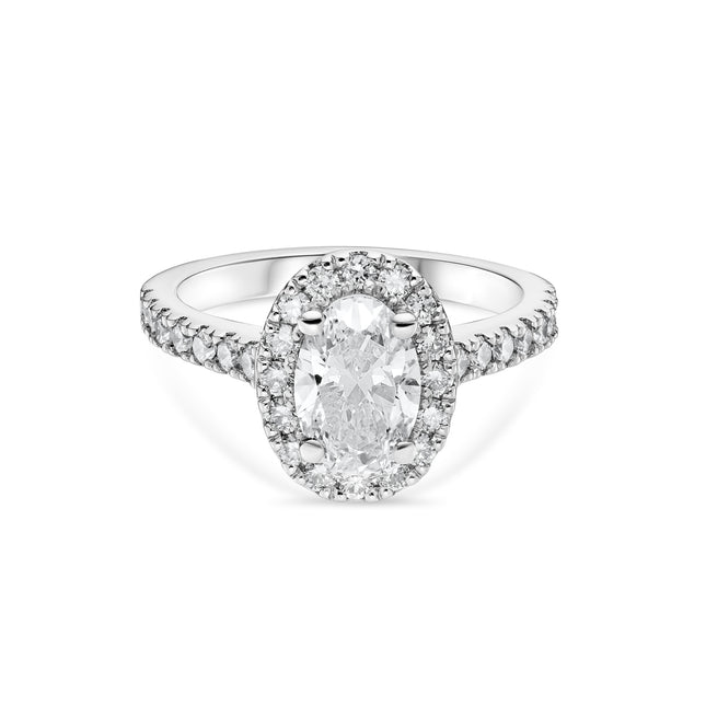 Oval Diamond Halo Ring with Side Stones in Platinum