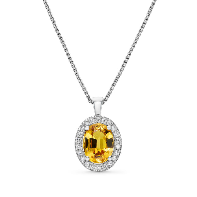 Oval Cut Yellow Sapphire Halo Pendant in White Gold