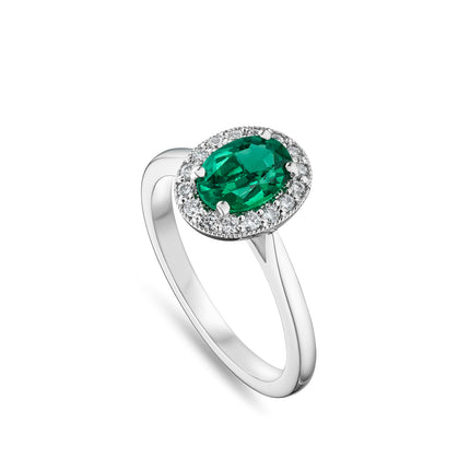 Oval Cut Emerald Halo Ring in Platinum