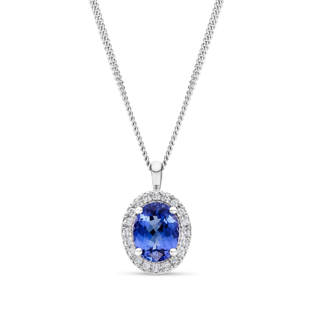 Oval Cut Tanzanite and Diamond Halo Pendant in White Gold