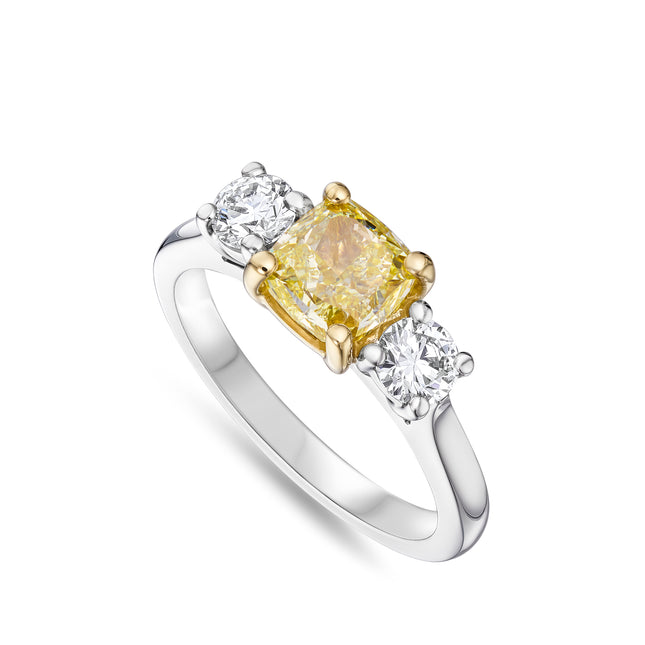Cushion Cut Yellow Diamond Trilogy Ring in Yellow Gold and Platinum