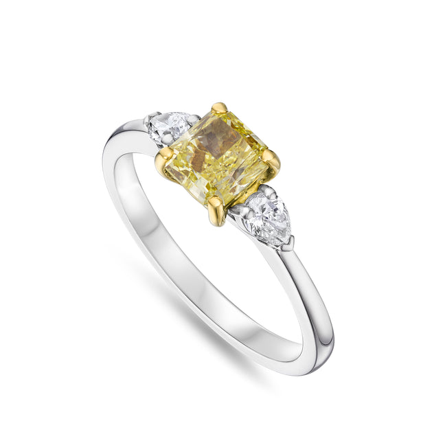 Cushion Cut Yellow Diamond Trilogy Ring in Yellow Gold and Platinum