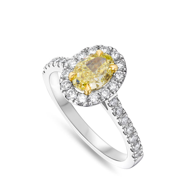 Oval Cut Yellow Diamond Halo Ring in Yellow Gold and Platinum