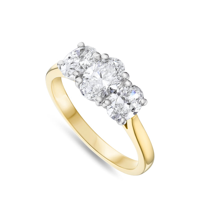 Oval Cut Diamond Trilogy Ring in Yellow Gold and Platinum