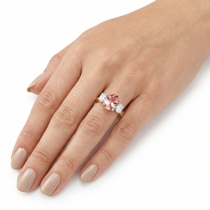 Oval Cut Pink Tourmaline and Diamond Trilogy Ring in Yellow Gold and Platinum