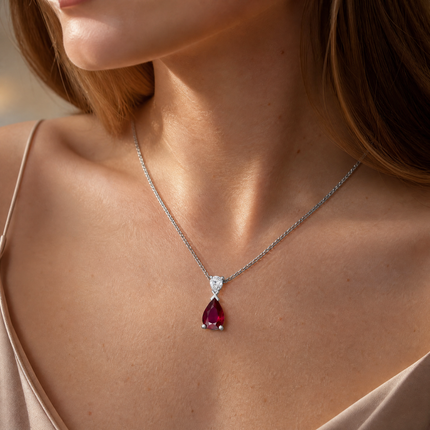 Pear Cut Ruby and Diamond Pendant in White Gold