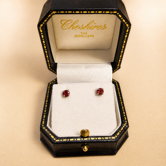 Round Cut Ruby Stud Earrings in White Gold
