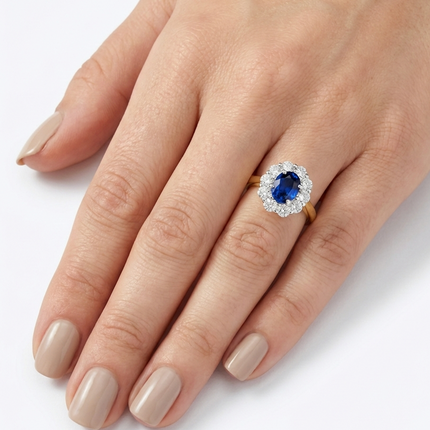 Oval Cut Sapphire and Diamond Cluster Ring in Yellow Gold and Platinum